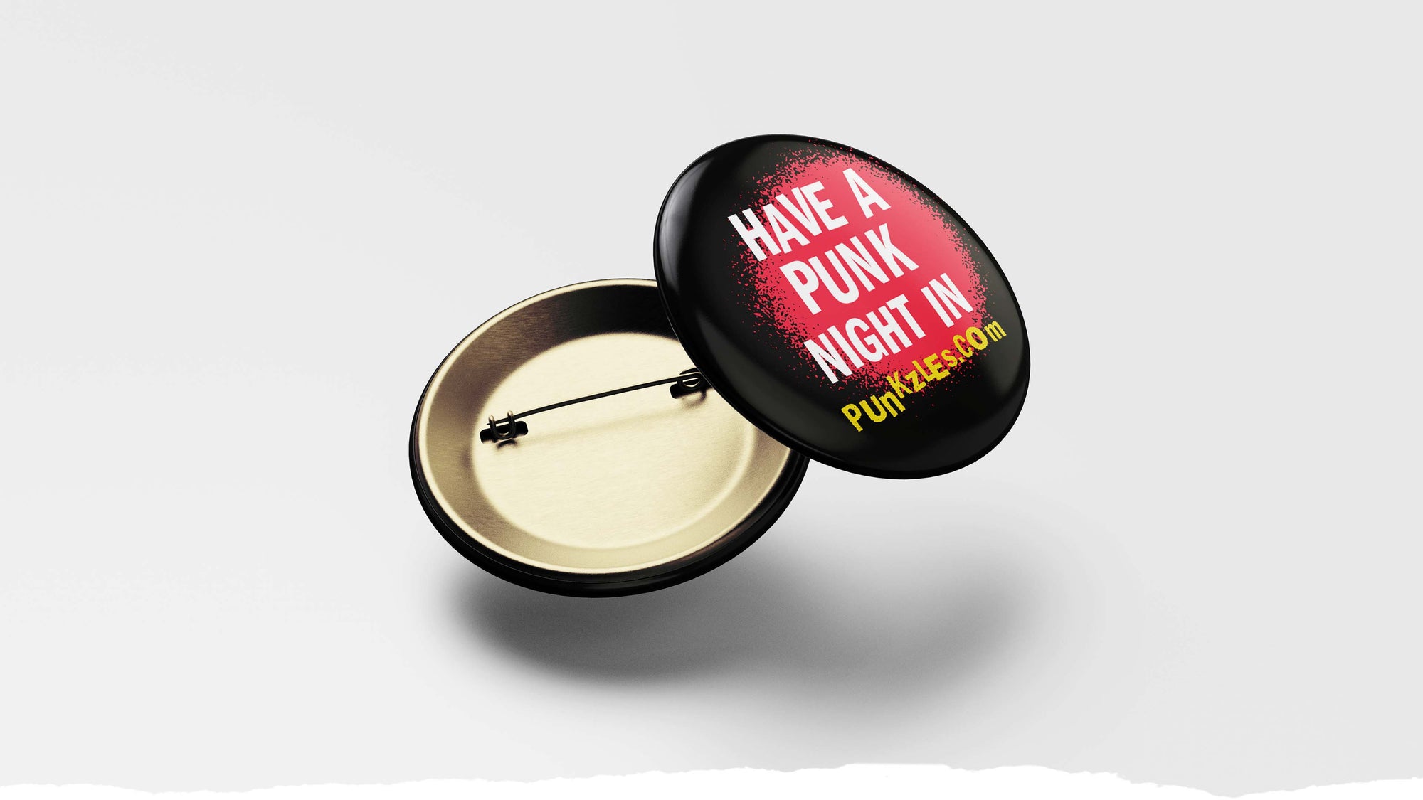 photograph of pin that says 'Have a punk night in. punkzles.com'