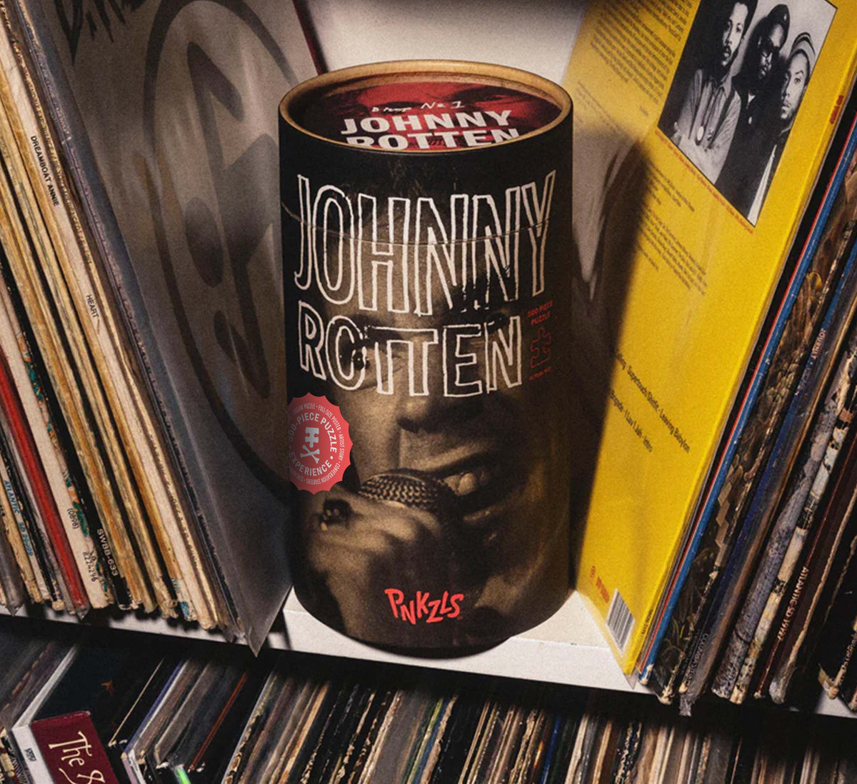 Shot of Johnny Rotten puzzle package on a shelf with record albums