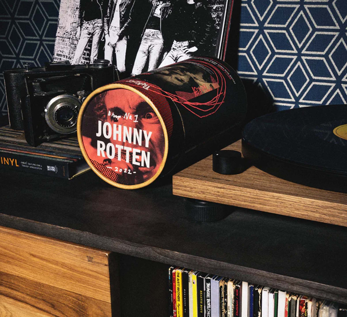 Shot of Johnny Rotten puzzle on it&#39;s side next to a record player